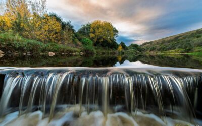 A stream overflowing a weir after the good rains – Photo Of The Day by Clive Wright